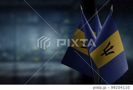 Small flags of the Barbados on an abstract blurry background 99204110