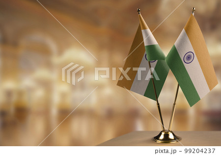 Small flags of the India on an abstract blurry background Small flags of the India on an abstract blurry background 99204237