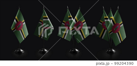 Small national flags of the Dominica on a black background Small national flags of the Dominica on a black background 99204390