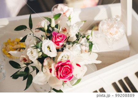 Bright wedding bouquet of the bride with white eustoma and pink roses 99208889