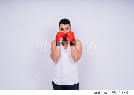 Young caucasian handsome man isolated on white background with boxing gloves 99213345