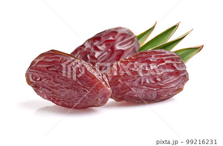 Dates fruit with leaves on white background Dates fruit with leaves on white background 99216231
