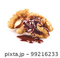 Walnuts kernel with chocolate drop in closeup on white background 99216233