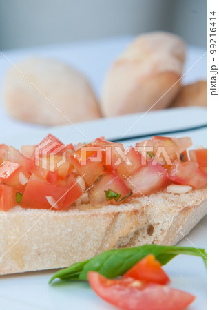Delicious traditional Mediterranean bread with tomato and olive oil 99216414