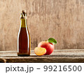Apple vinegar cider with apple fruits on old wooden background. Fermented product 99216500