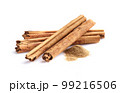 Cinnamon bark with powder in closeup 99216506