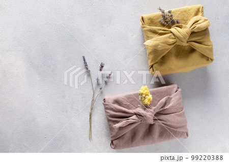 Eco-friendly fabric reusable gift packaging with dried flowers. Eco-friendly fabric reusable gift packaging with dried flowers. 99220388