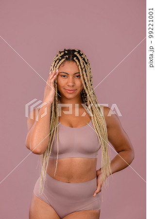 Portrait of happy multiracial woman, studio shoot. 99221001