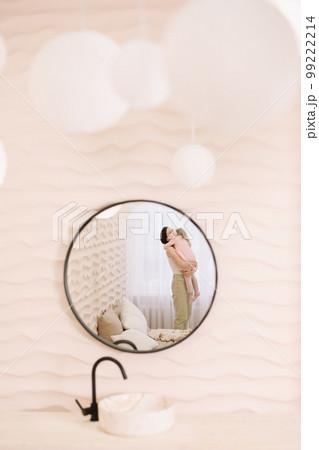 Woman in light clothes have fun with cute child baby girl 3 years old. Mommy little kid daughter on beige background studio portrait. Mother's Day love family parenthood childhood concept 99222214