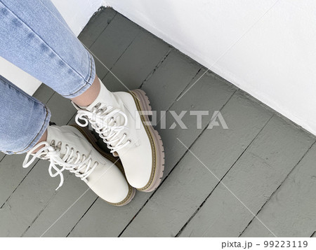 female legs in high boots. fashionable young woman female legs in high boots. fashionable young woman 99223119