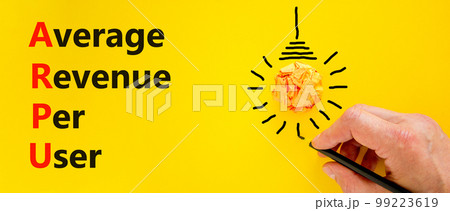 ARPU average revenue per user symbol. Concept words ARPU average revenue per user on yellow paper on beautiful yellow background. Business ARPU average revenue per user concept. Copy space. 99223619