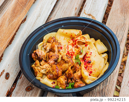 Close up shot of hand pulled noodle with chicken 99224215