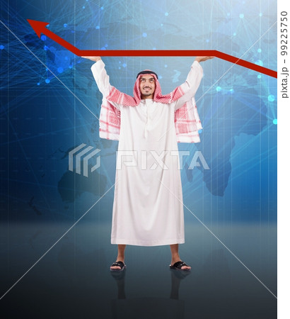 Arab businessman supporting oil price Arab businessman supporting oil price 99225750