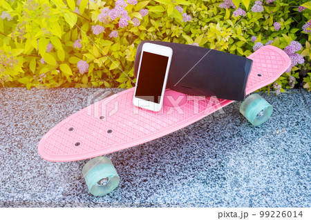 Skateboard and phone close-up. Life style. Sport Skateboard and phone close-up. Life style. Sport 99226014