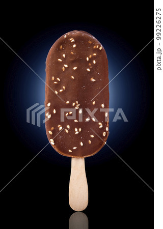 Beautiful ice cream with nuts on a black-blue background Beautiful ice cream with nuts on a black-blue background 99226275