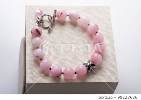 author bracelet with natural cherry jasper. fashion and jewelry concept author bracelet with natural cherry jasper. fashion and jewelry concept 99227626