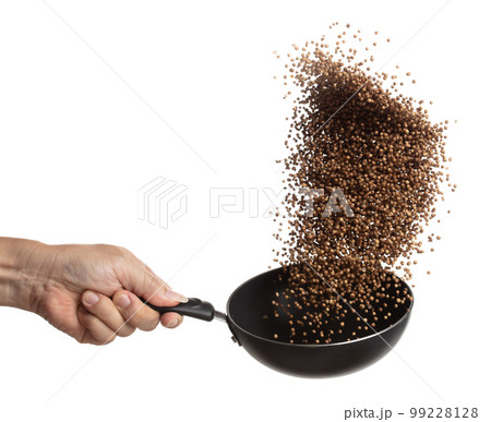 Coriander seed fry throw up in Pan, brown coriander seed float explode, abstract cloud fly. Dried coriander seeds splash throwing in Air. White background Isolated high speed shutter, freeze motion 99228128