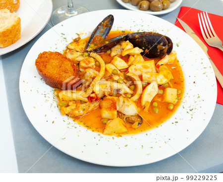Fried cuttlefish in spicy sauce Fried cuttlefish in spicy sauce 99229225