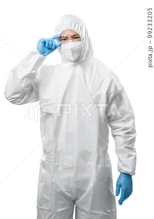 Worker wears medical protective suit or white coverall suit with mask and goggles Worker wears medical protective suit or white coverall suit with mask and goggles 99233205