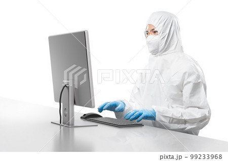 Worker wears medical protective suit or coverall suit work with computer isolated on white background Worker wears medical protective suit or coverall suit work with computer isolated on white background 99233968
