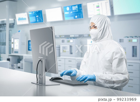 Worker or engineer wears protective suit or coverall suit work in semiconductor manufacturing factory 99233969
