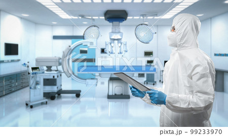 Doctor wears medical protective suit or coverall suit with mri scan machine Doctor wears medical protective suit or coverall suit with mri scan machine 99233970
