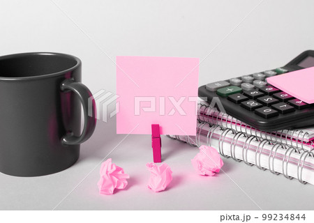 Coffee Cup Standing on Desk. Important infrormation written on paper. Different Office Supplies, Pencils, Pens, Marckers. Computer keyboard. Text on wood table. Coffee Cup Standing on Desk. Important infrormation written on paper. Different Office Supplies, Pencils, Pens, Marckers. Computer keyboard. Text on wood table. 99234844