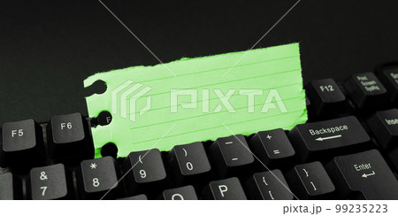 Colored sticker lying on black keyboard. Important information written over paper. Image with school supplies. Multiple Assorted Collection Office Stationery. Colored sticker lying on black keyboard. Important information written over paper. Image with school supplies. Multiple Assorted Collection Office Stationery. 99235223