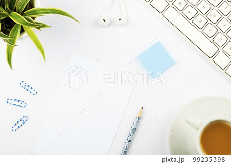Coffee Cup Standing on Desk. Important infrormation written on paper. Different Office Supplies, Pencils, Pens, Marckers. Computer keyboard. Text on wood table. Coffee Cup Standing on Desk. Important infrormation written on paper. Different Office Supplies, Pencils, Pens, Marckers. Computer keyboard. Text on wood table. 99235398