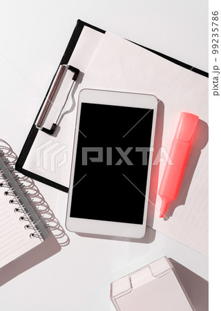 Mobile Phone Screen With Important Ideas On It And Note Sticked On It On Desk With Notebook And Marker. Cellphone With Crutial Informations And Memo Attached To It. 99235786
