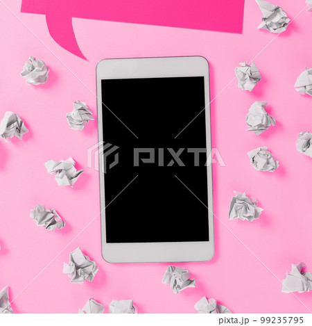 Important Message Presented On Phone On Desk With Paperwraps, Paper. Crutial Information Shown On Cellphone Screen Placed On Table. New Ideas On Mobile Phone. 99235795