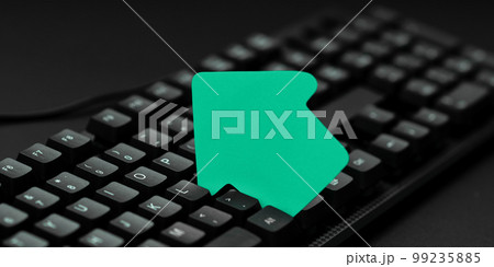 Colored sticker lying on black keyboard. Important information written over paper. Image with school supplies. Multiple Assorted Collection Office Stationery. Colored sticker lying on black keyboard. Important information written over paper. Image with school supplies. Multiple Assorted Collection Office Stationery. 99235885