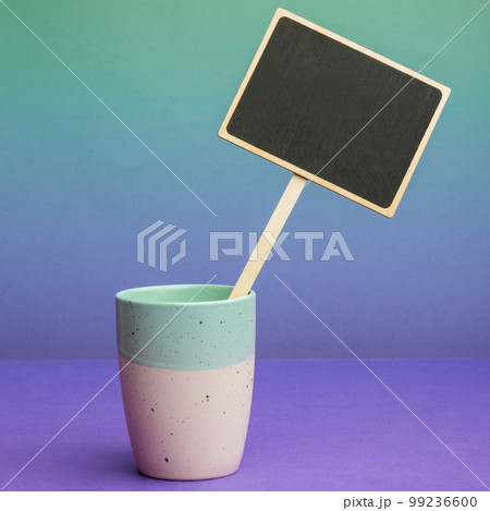 Coffee Cup Standing on Desk. Important infrormation written on paper. Different Office Supplies, Pencils, Pens, Marckers. Computer keyboard. Text on wood table. Coffee Cup Standing on Desk. Important infrormation written on paper. Different Office Supplies, Pencils, Pens, Marckers. Computer keyboard. Text on wood table. 99236600
