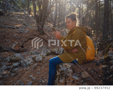 caucasian woman enjoys being in nature, 99237452