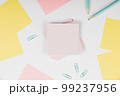 Notebook and Colored Papers Stickers Lying On White Desk. Multiple Assorted Collection Office Stationery. Photo With Pens Pencils Rullers Calculators. 99237956