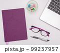 Office Supplies Over Desk With Keyboard And Glasses And Coffee Cup For Working Remotely, Assorted School Utilities For Studying With Hot Drink And Eyeglasses. 99237957