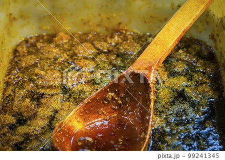 Thick honey with perga, wooden spoon. Healthy food concept, diet Thick honey with perga, wooden spoon. Healthy food concept, diet 99241345
