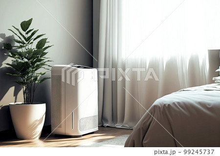 white air purifier in room with technology to clean air and eliminate odors 99245737