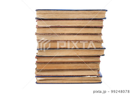 A stack of old books isolated on a white background. Close-up 99248078