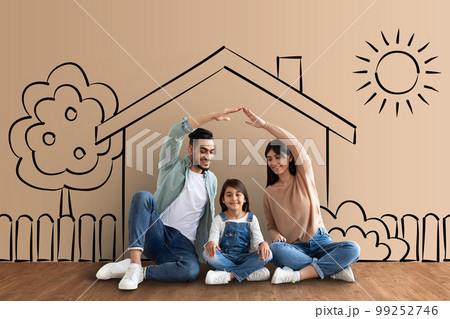 Loving middle eastern parents making roof over their daughter Loving middle eastern parents making roof over their daughter 99252746