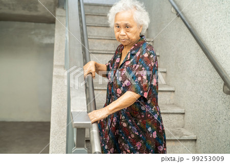 Asian senior or elderly old lady woman patient use slope walkway handle security with help support assistant, healthy strong medical concept. Asian senior or elderly old lady woman patient use slope walkway handle security with help support assistant, healthy strong medical concept. 99253009