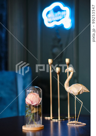 Stylish statuette of flamingo and rose in a glass jar 99253547