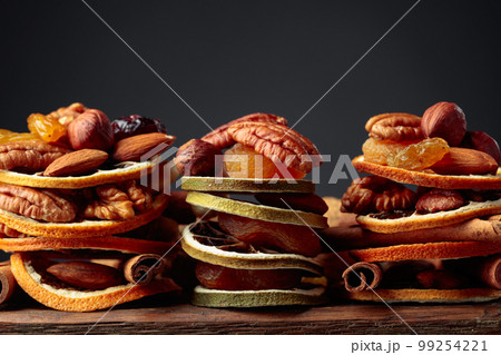 Christmas still-life with dried fruits and nuts. Christmas still-life with dried fruits and nuts. 99254221