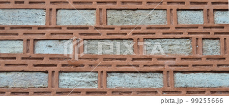 Sturdy beige and red cut stone wall, seamless lined up Sturdy beige and red cut stone wall, seamless lined up 99255666