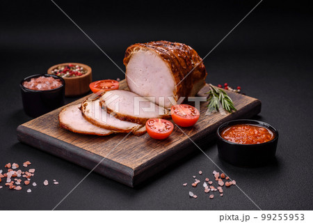 Delicious fresh smoked meat or ham with spices and herbs Delicious fresh smoked meat or ham with spices and herbs 99255953