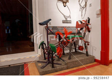 Interior view of red room of the Erotic Museum of Barcelona. The antique chair of pleasure, handcuffs and erotic art. Interior view of red room of the Erotic Museum of Barcelona. The antique chair of pleasure, handcuffs and erotic art. 99258447