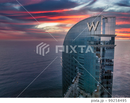 Panoramic aerial view of famous Barceloneta beach with hotel luxury W Barcelona. Birds eye of Barcelona, Catalunya, Spain. 99258495