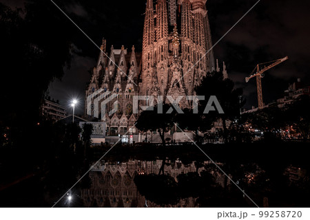 Night view of the La Sagrada Familia cathedral. Impressive cathedral designed and unfinished by Gaudi in the center of Barcelona. Night view of the La Sagrada Familia cathedral. Impressive cathedral designed and unfinished by Gaudi in the center of Barcelona. 99258720