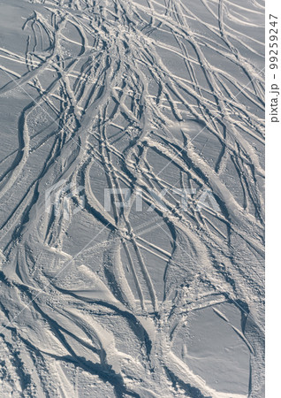 deep trace from ski and snowboard on snow winter mountain slope, freeride deep trace from ski and snowboard on snow winter mountain slope, freeride 99259247
