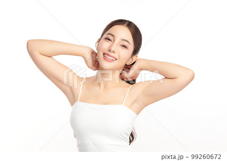 Beautiful Young Asian woman lifting hands up to show off clean and hygienic armpits or underarms on white background, Smooth armpit cleanliness and protection concept 99260672